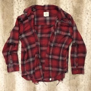 Distressed flannel with holes in elbow